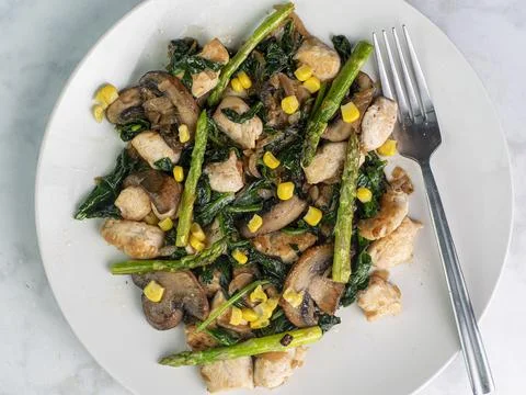 Chicken with sauteed vegetables Stock Photos