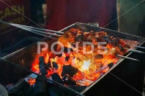 Chicken seekh kababs are being prepared road side Stock Photos