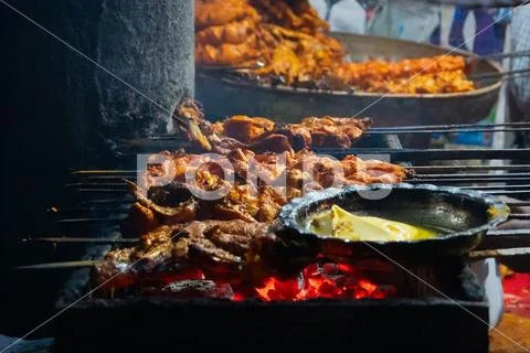 Chicken seekh kababs are being prepared road side Stock Photos