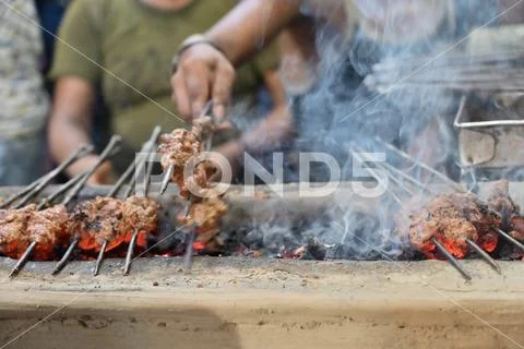 Chicken seekh kababs are being prepared road side Stock Photos