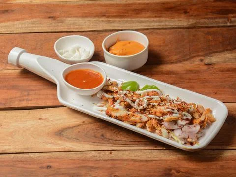 Chicken shawarma platter served on rustic wooden background. Dishes and appet Stock Photos