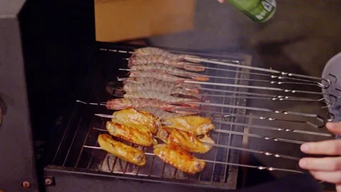 Chicken skewers flare up while grilling on barbecue Stock-Footage 316226493