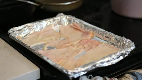 Chicken skin getting ready to get crispy Stock Footage 334969676