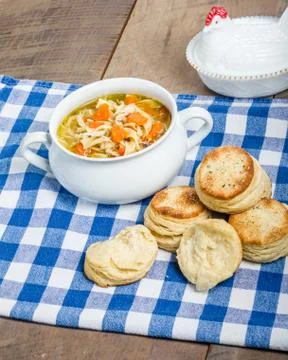 Chicken soup and biscuits on table Foto stock