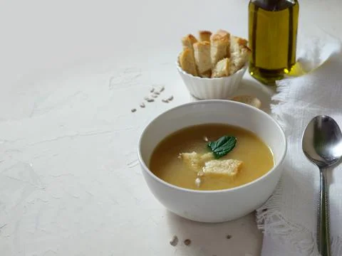 Chicken soup on white kitchen table with bread Stock Photos