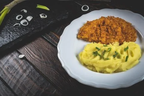 Chicken steak or schnitzel with mashed potatoes Stock Photos