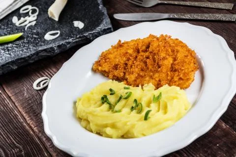Chicken steak or schnitzel with mashed potatoes Stock Photos