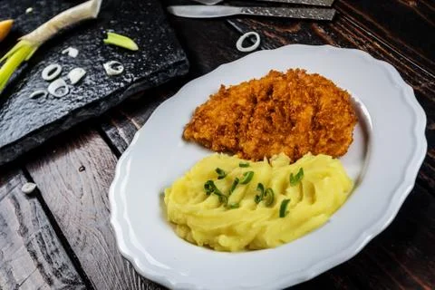 Chicken steak or schnitzel with mashed potatoes Stock Photos