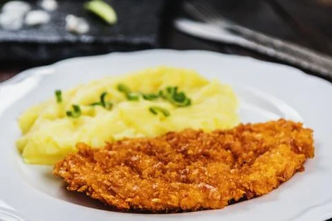 Chicken steak or schnitzel with mashed potatoes Stock Photos
