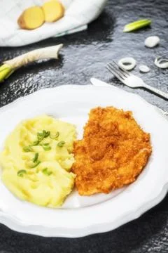 Chicken steak or schnitzel with mashed potatoes Stock Photos