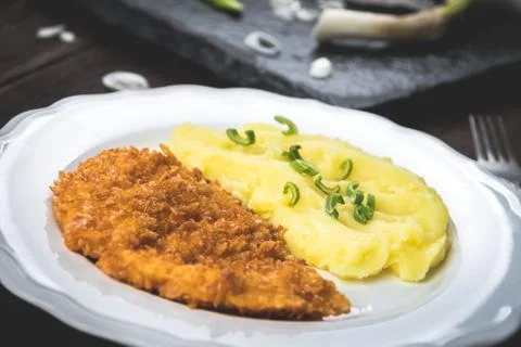 Chicken steak or schnitzel with mashed potatoes Stock Photos
