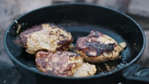 Chicken Steaks Frying in a Pan Stock Footage 284932499
