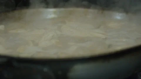Chicken steaming cooking hot boiling bubbling in pan italian restaurant kitchen Stock Footage 238715840