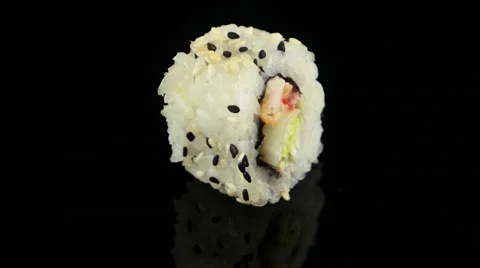Chicken sushi roll on black background rotating (loop) Stock Footage 55639025
