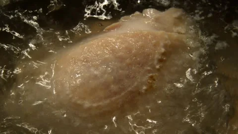 Chicken thigh is being boiled Stock Footage 273274806