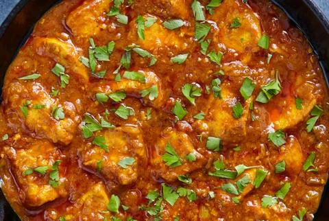 Chicken tikka masala close up texture, traditional spicy meat food Stock Photos