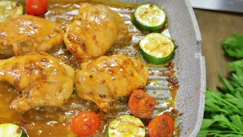 Chicken with vegetables is fried in a grill pan 库存影片 112717380