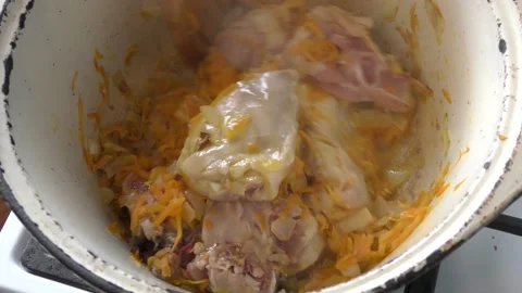 Chicken with vegetables is fried in a pan Stock Footage 167440610