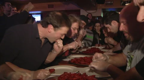 Chicken wing eating contest Stock Footage