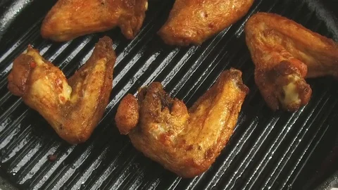 Chicken wing on the grill turn slow motion Video stock 79540202