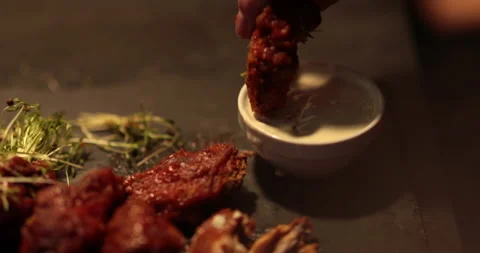 Chicken wings are cooked, lying on a plate in the restaurant, ready to eat. Stock Footage 241183202