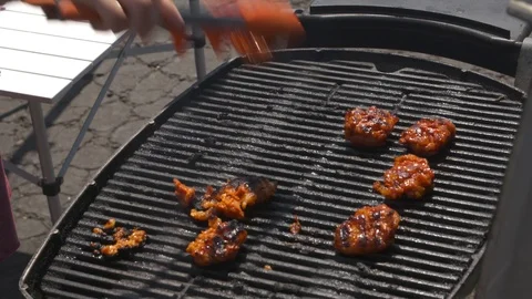 Chicken wings cooking on a grill Stock Footage 106593333
