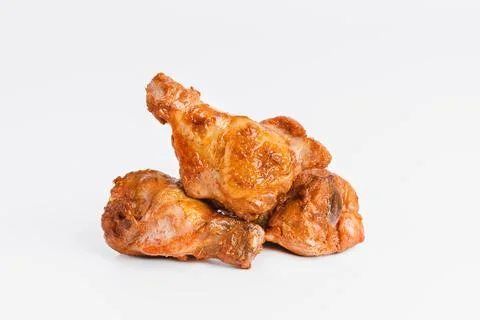 Chicken wings fried until half cooked, semi-finished product with fresh herbs on Stock Photos
