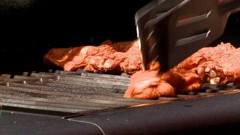 Chicken wings put on the grill Stock Footage 84992196