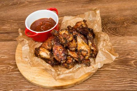 Chicken wings with  sauce. Stock Photos