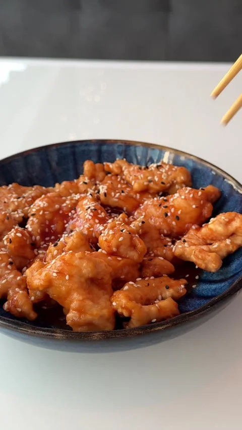 Chicken wings in sweet and sour sauce with sesame Stock Footage 346188043