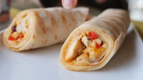 Chicken wrap being prepared at a cafe kitchen Stock Footage 340497151