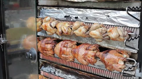 Chickens roast on a spit Stock Footage 35720806