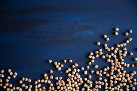 Chickpea on a blue wood surface Stock Photos