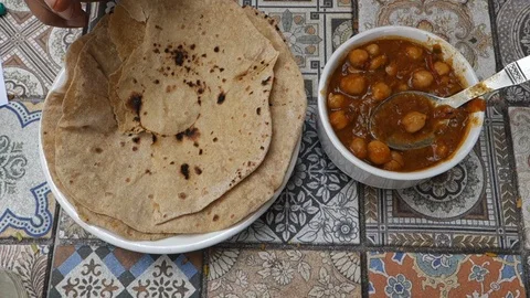 Chickpea curry with Indian bread Stock Footage 86198872