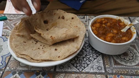 Chickpea curry with Indian bread Stock Footage 86198889