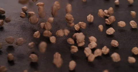 Chickpea falling on table surface 4K video Stock Footage 108779505