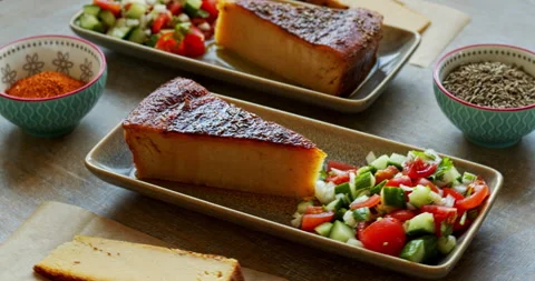 Chickpea flour bread, vegetable salad, and spices. Stock Footage 277116450