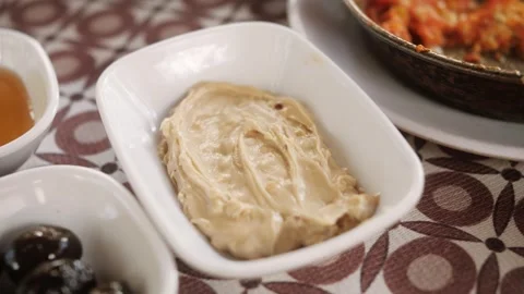 Chickpea hummus made from mashed chickpeas close-up. Kosher healthy vegan food Stock Footage 246302763