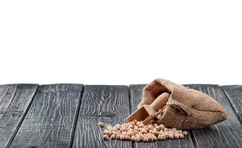 Chickpea spill out of bag and scoop Stock Photos