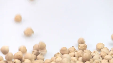 Chickpea on white background falling from top and filling up frame. slow moti Stock Footage 108041192