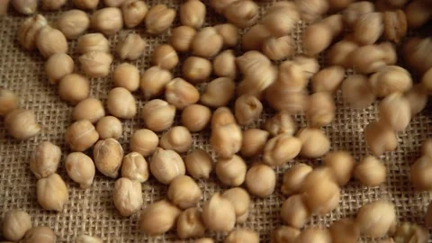 Chickpeas on burlap. Slow motion. 스톡 동영상 131885429