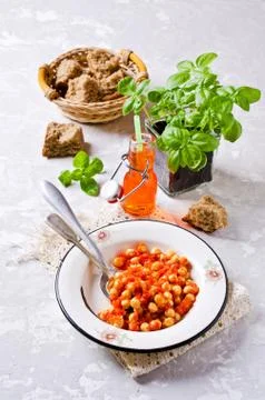 Chickpeas cooked with  sauce Stock Photos