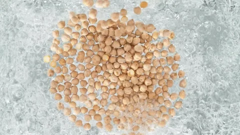 Chickpeas Falling into Pot of Boiling Water Stock Footage 271400211