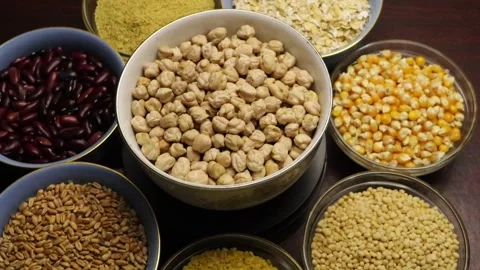 Chickpeas grains, mung beans, Legumes, cereals, oats, rajmas rotation on bowl. Stock Footage 283573053