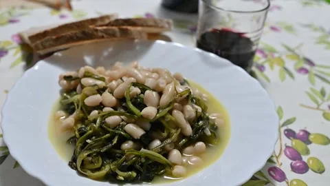 Chicory and bean soup cooked in a terracotta pan (8) Stock Footage 292414996