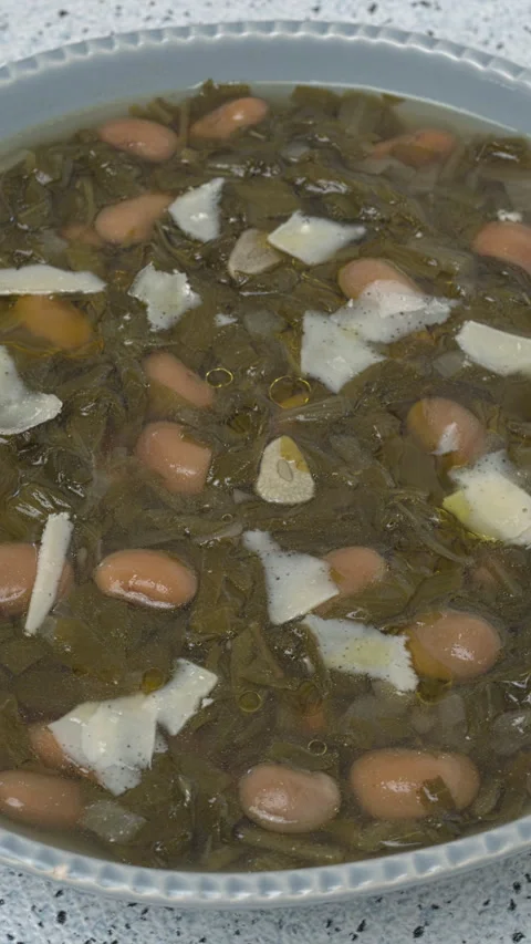 Chicory and bean soup. Vertical video. Video stock 312113636