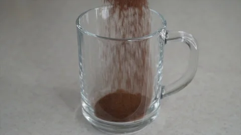 Chicory drink being made in transparent mug. Slow motion Stock Footage 104493206