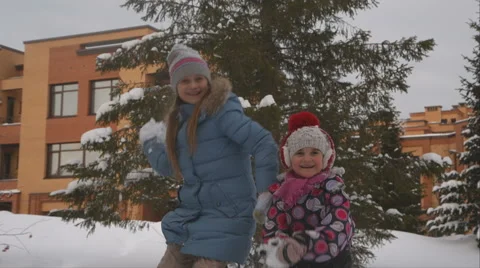 Chidren play snowballs Stock Footage 60409097
