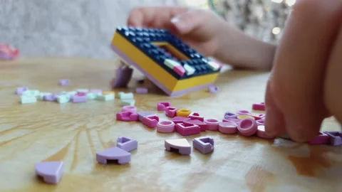 A chidren Playing with lego brick Stock Footage 135597133