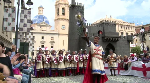 Chief of band performs dance in front of line with shields Stock Footage 47977647